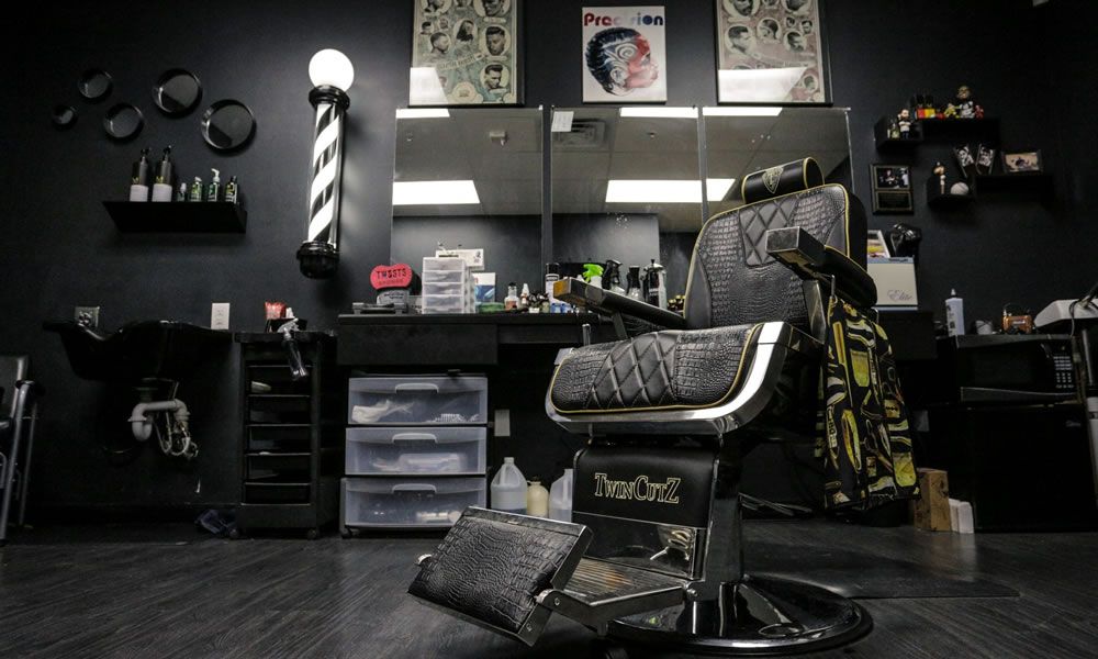 Warm and stylish modern barbershop interior with barber chair and grooming tools